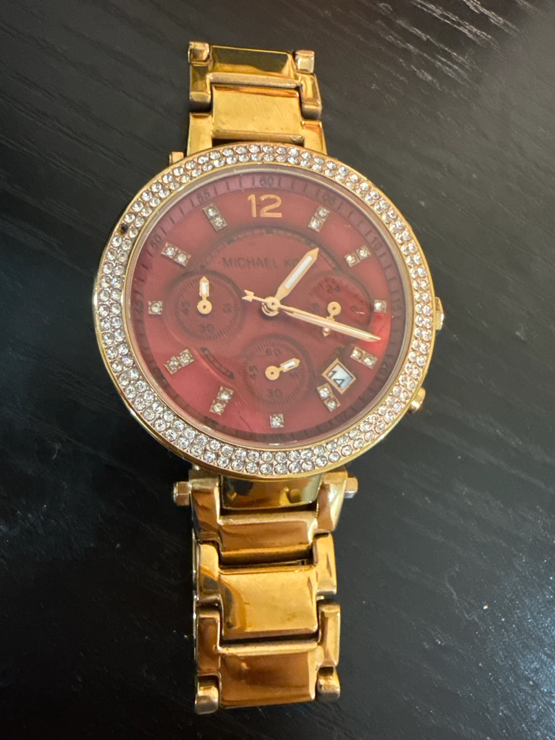 Michael Kors Goldtone Watch with Red Dial and Crystal Bezel
