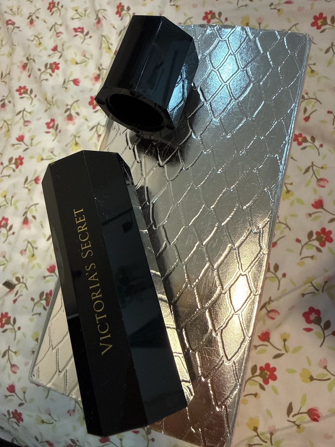 Victoria's Secret travel-size fragrance  case.