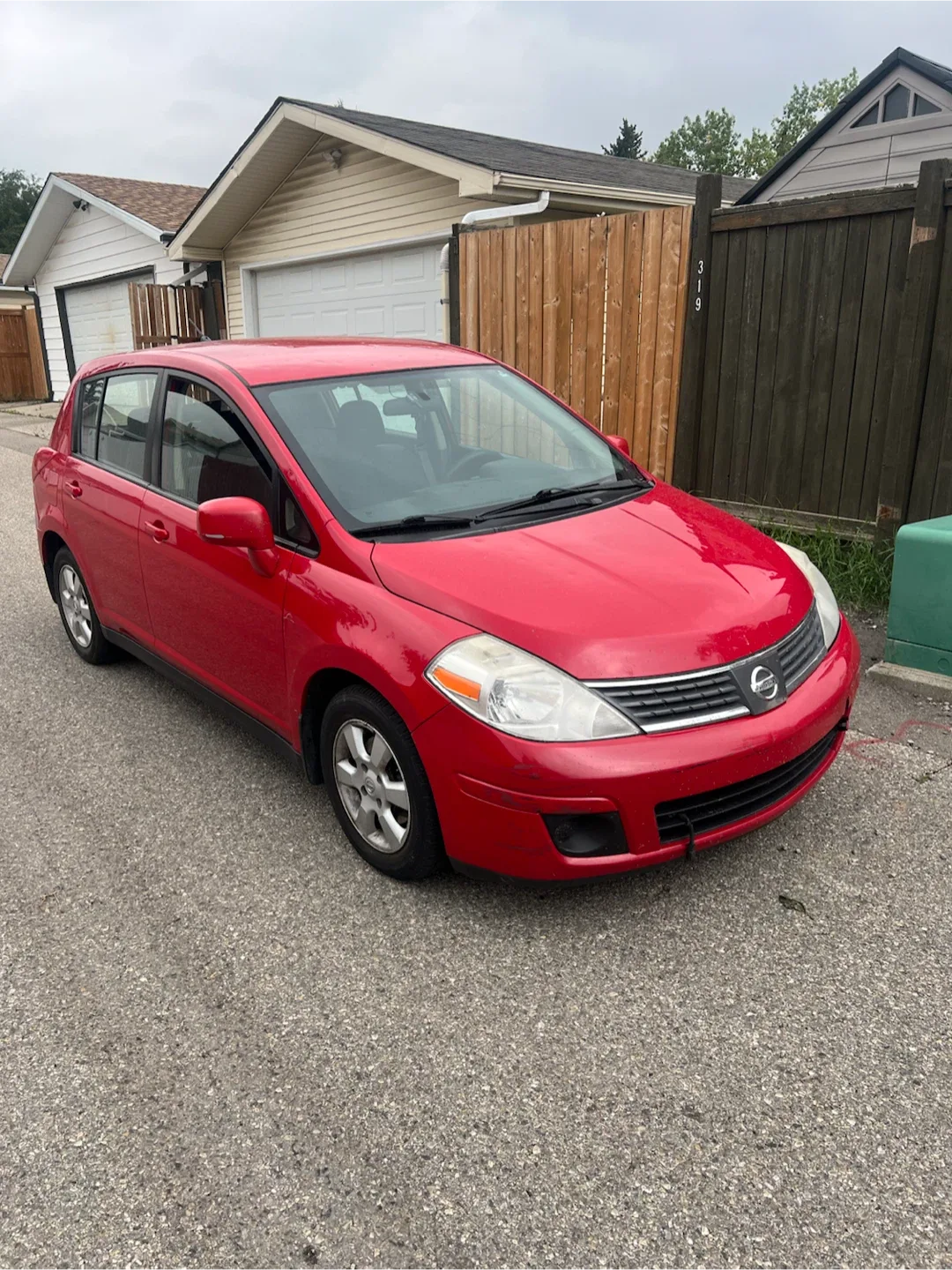 Red Nissan Versa Hatchback