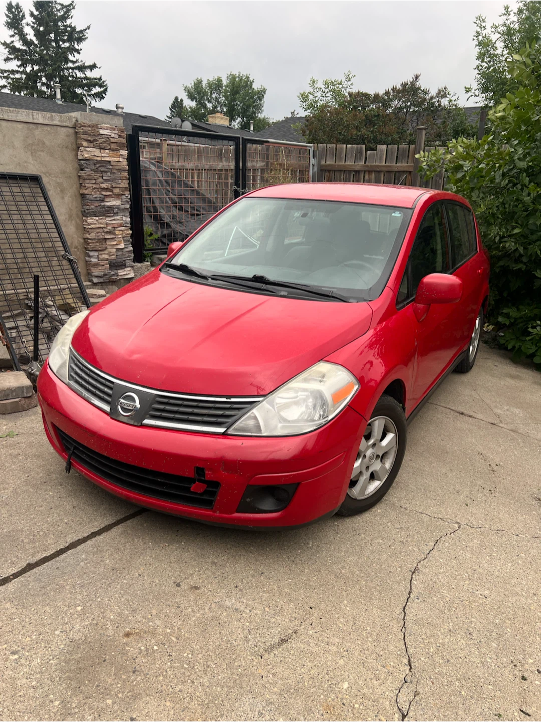 Red Nissan Versa Hatchback - photo 2