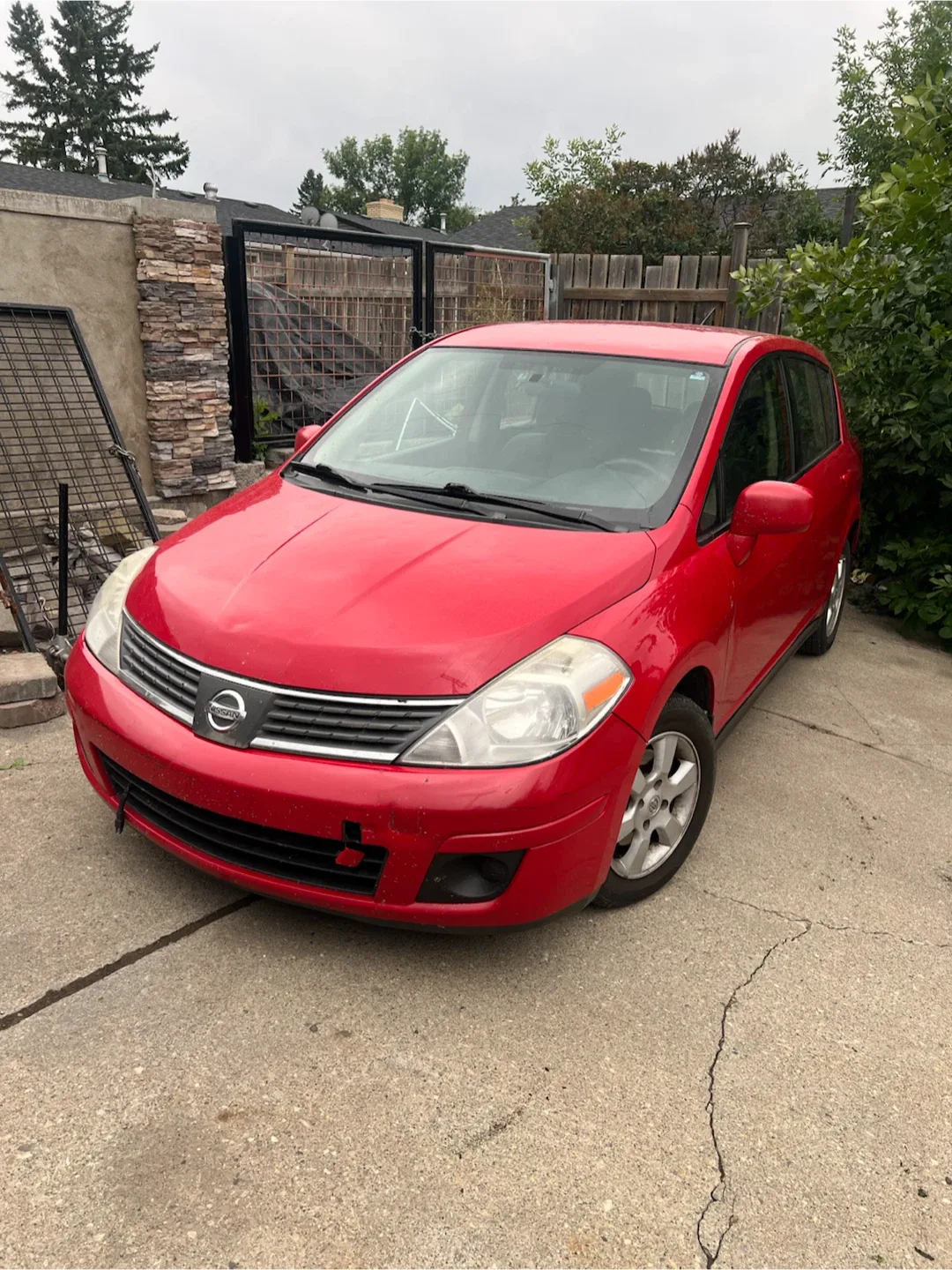 Red Nissan Versa Hatchback - photo 2