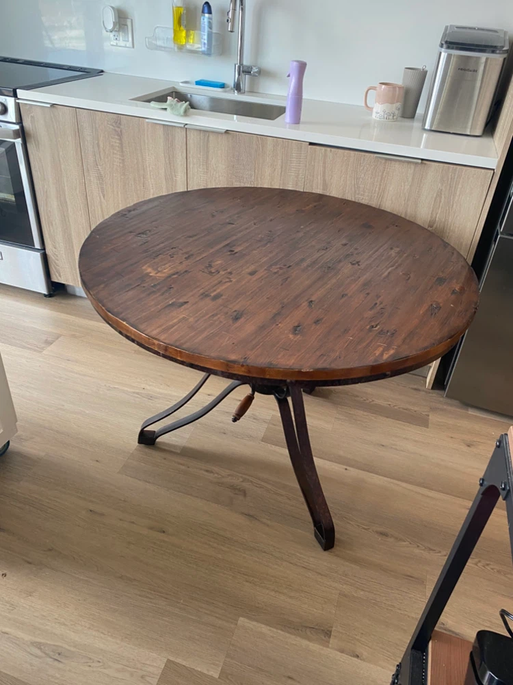 Round wood table with adjustable metal legs