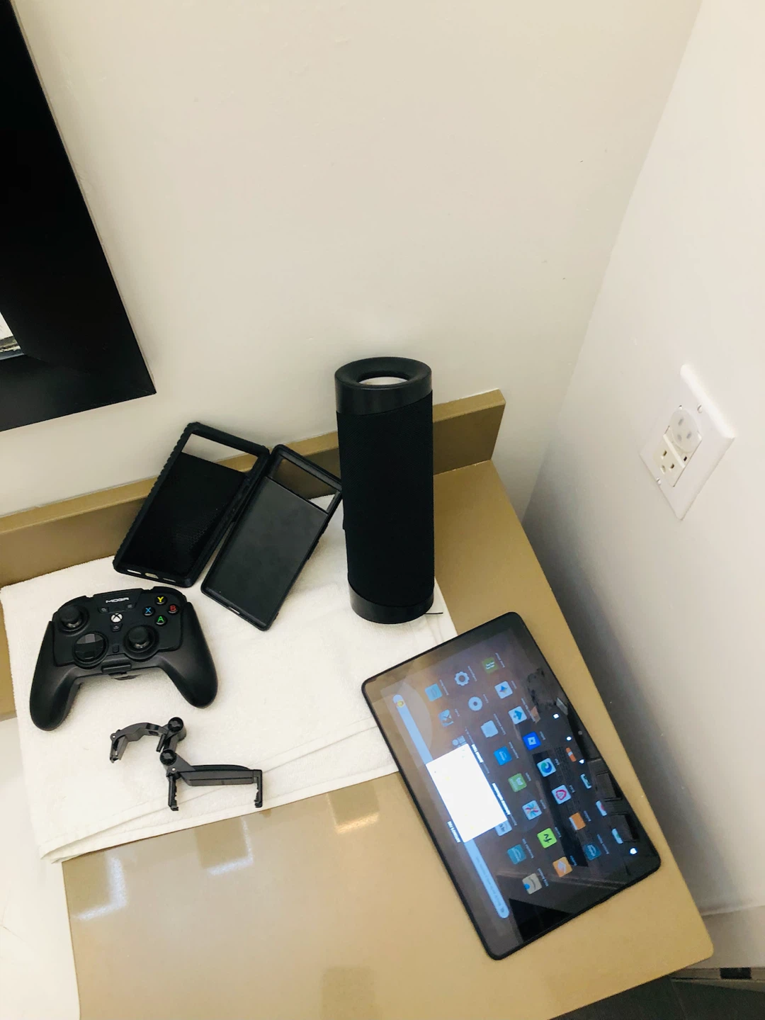 a tablet, a speaker and Xbox Control
