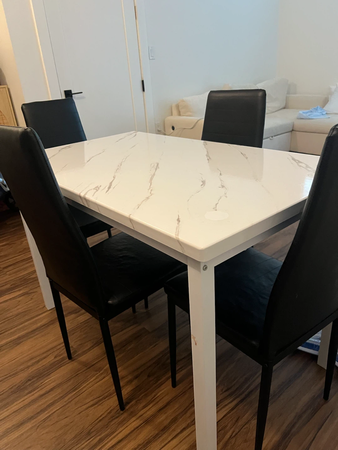 White Marble Dining Table with 4 Black Chairs