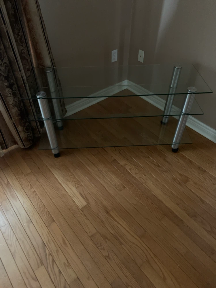 Glass and Metal TV Stand with wheels.