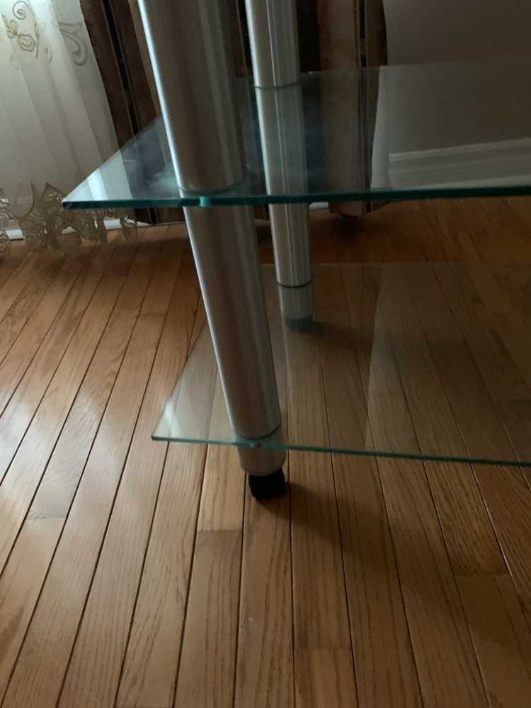 Glass and Metal TV Stand with wheels. - photo 3