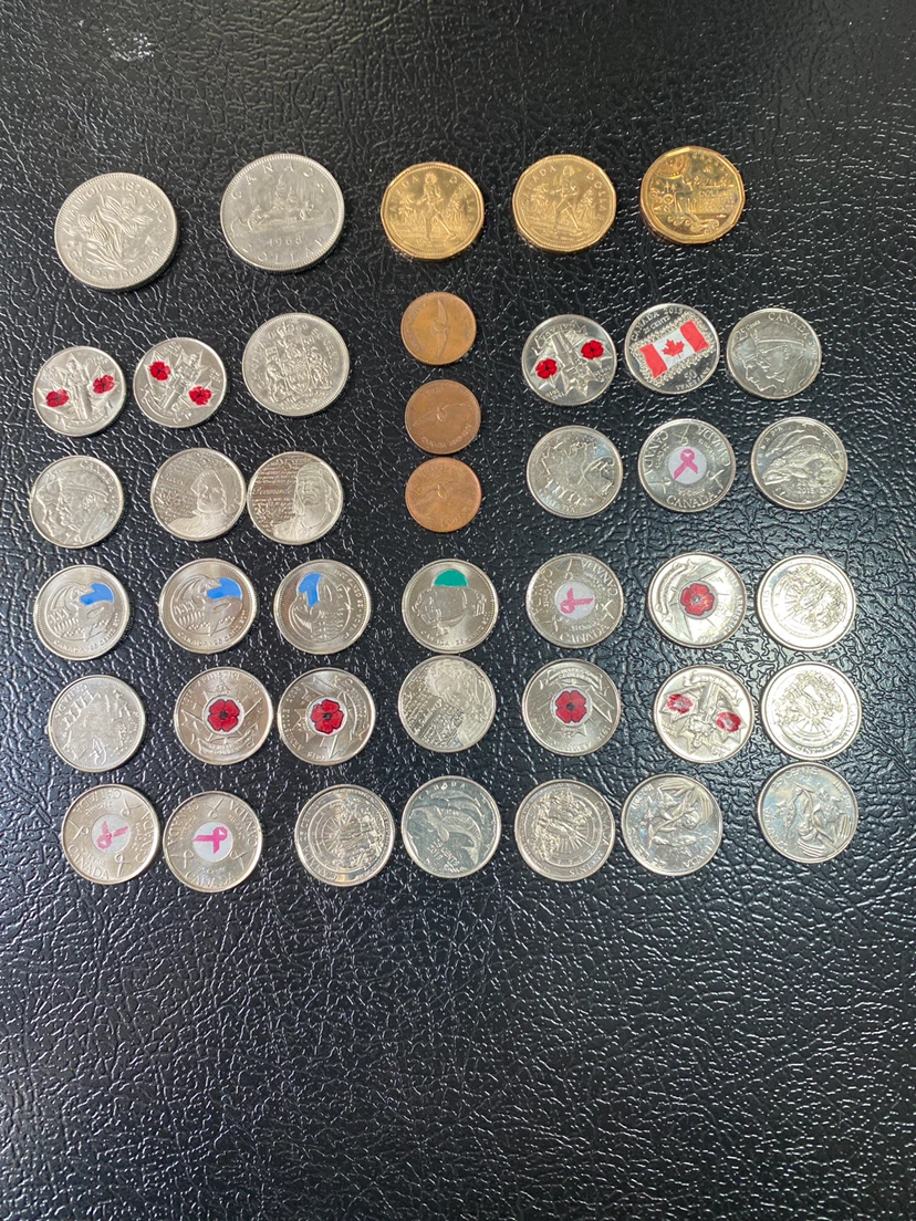Collection of Canadian Quarters, Dollars, and Pennies