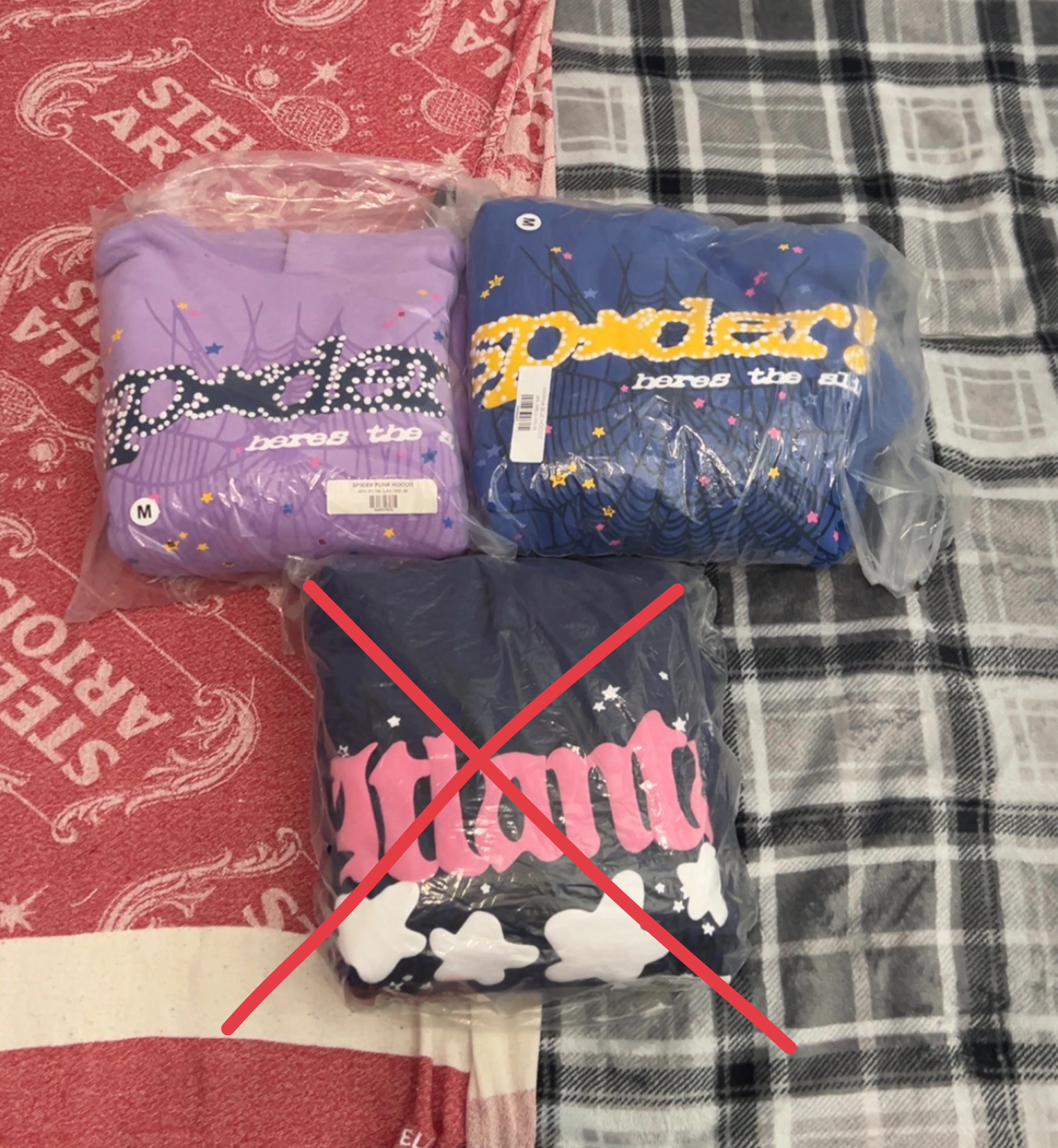 Two Sp5der hoodies