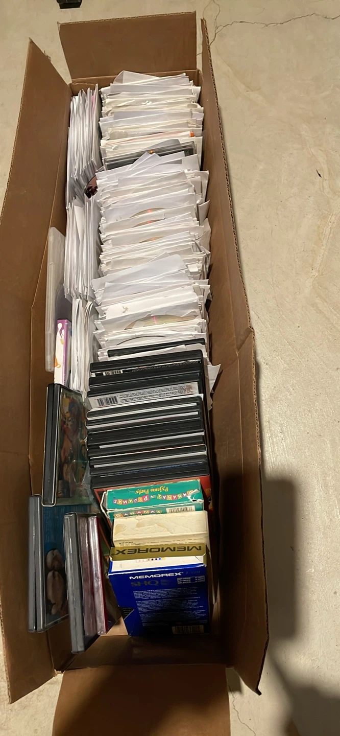 Box of CDs/DVDs and Cases