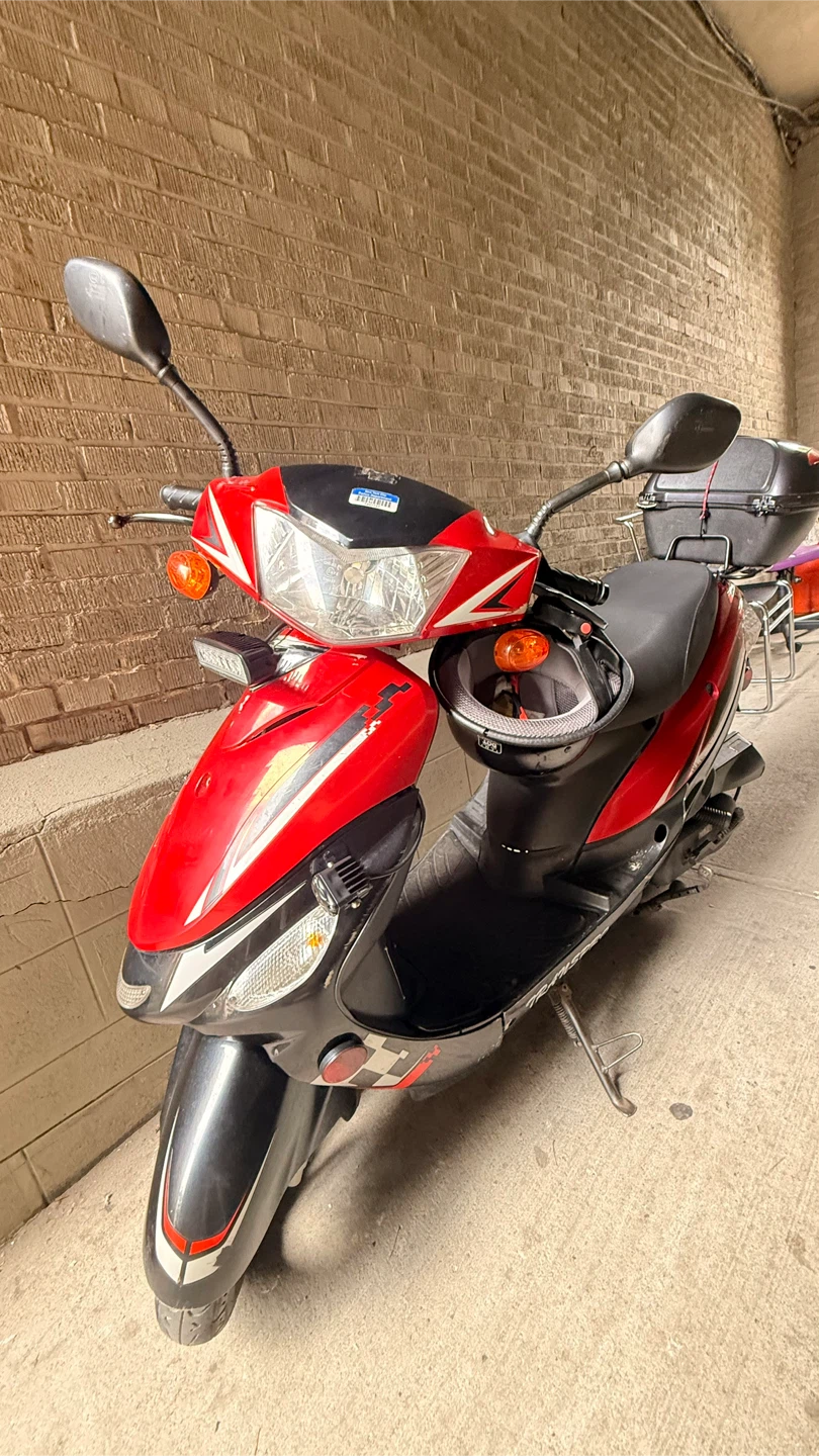 Red and Black Scooter with Storage Trunk