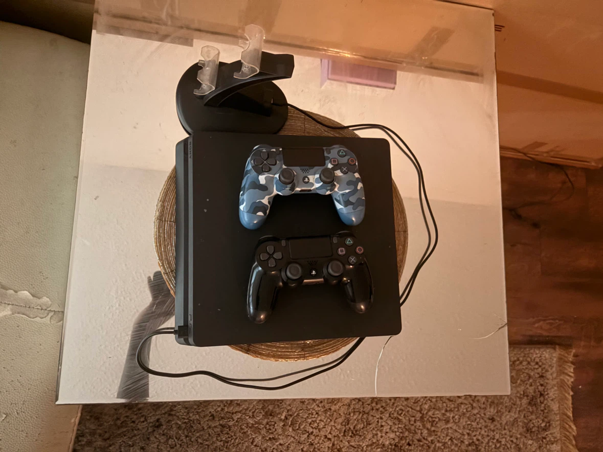 PlayStation 4  with 2 Controllers and charging dock