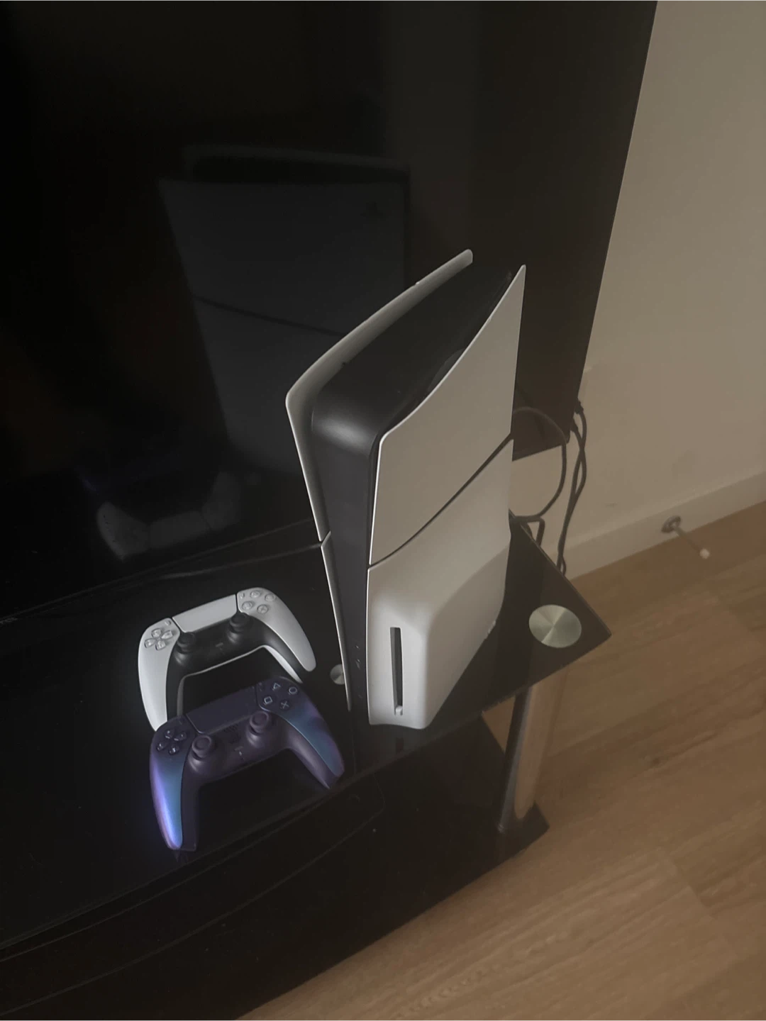 PlayStation 5 with two controllers