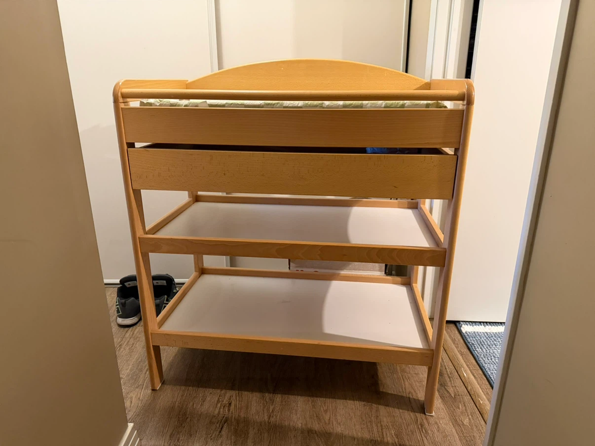 Change table with a sliding drawer and shelves