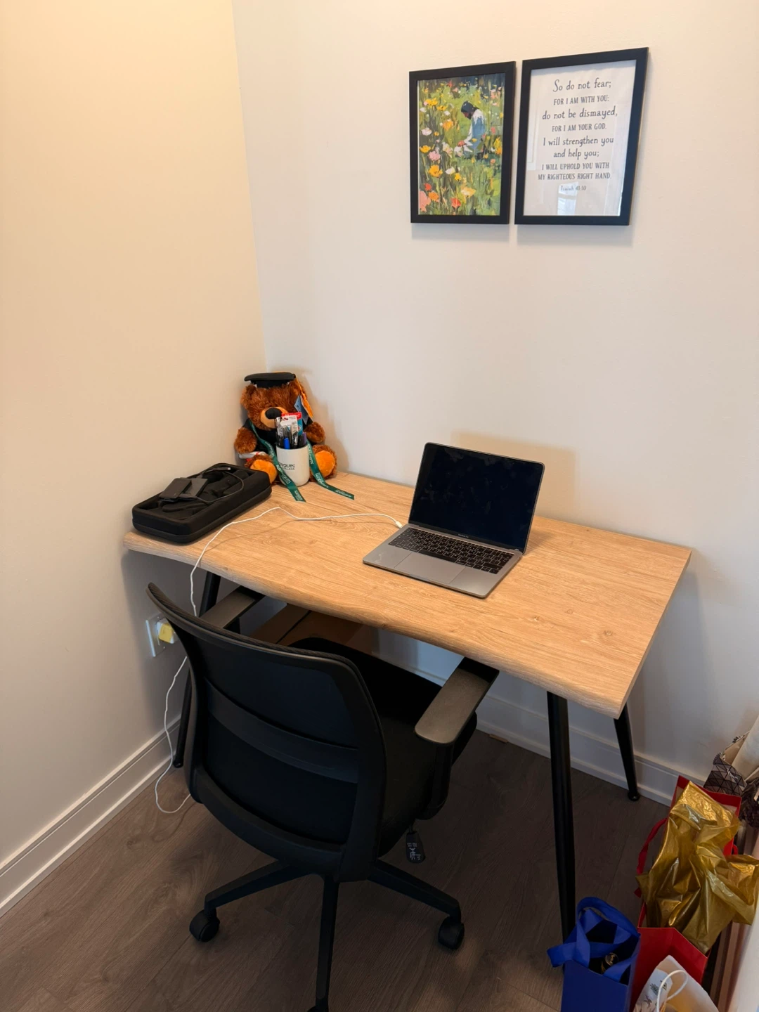 Wooden desk with black desk chair