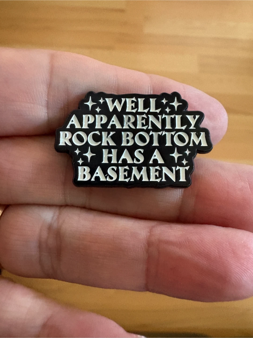 Well Apparently Rock Bottom has a Basement Enamel Pin