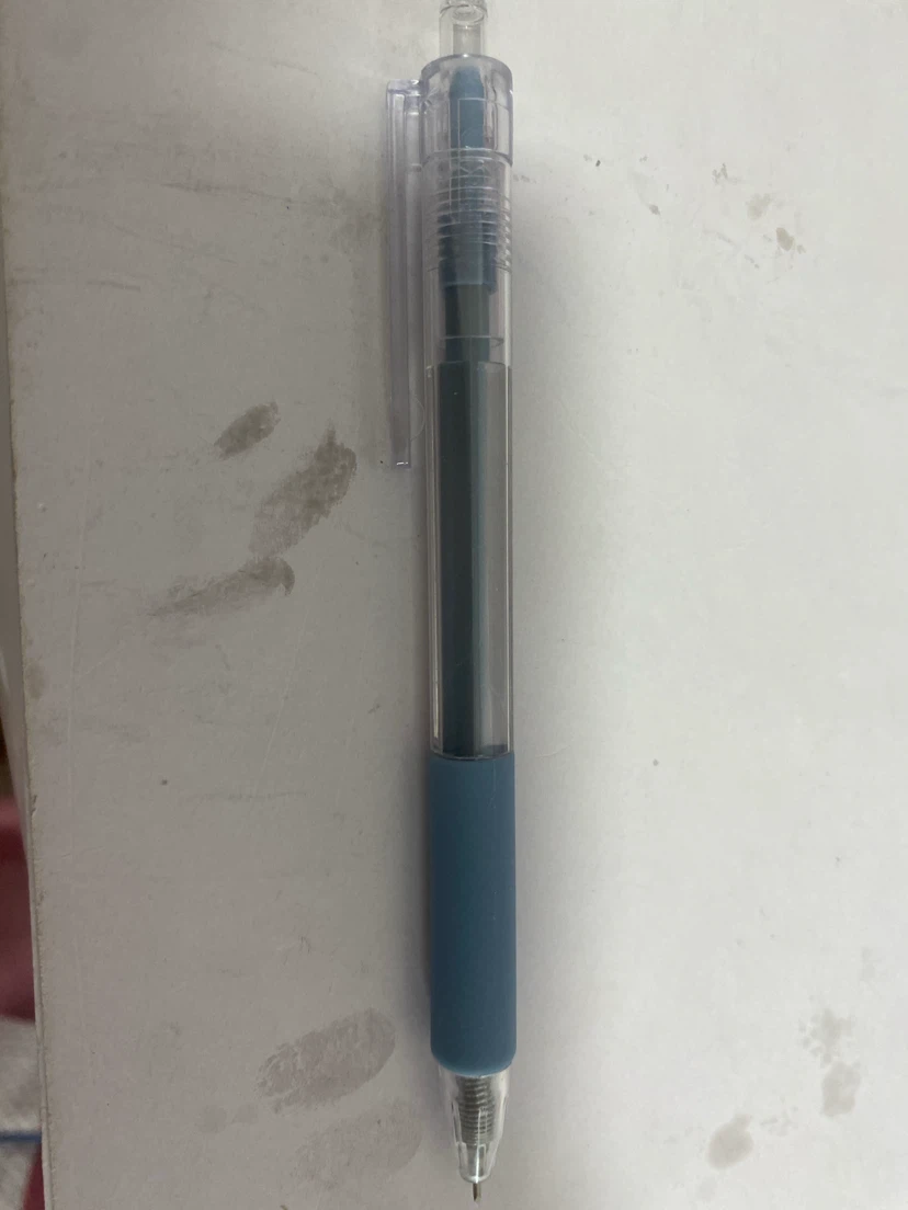 Clear barrel blue grip paper cutting pen