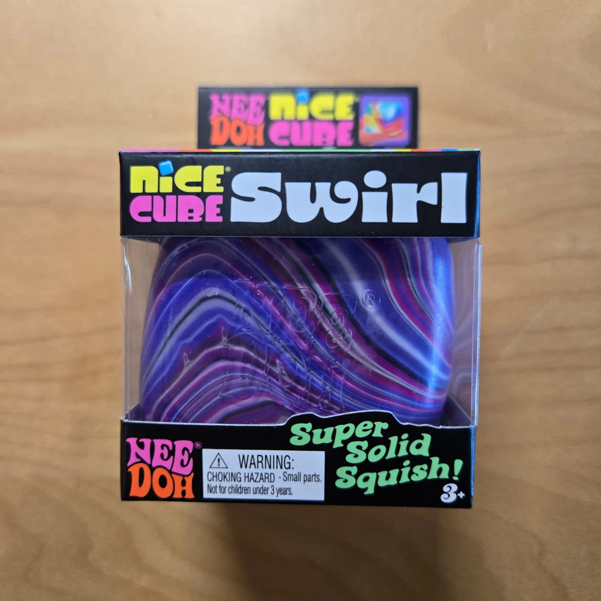 Brand new in box.  Schylling NeeDoh Nice Cube Swirl