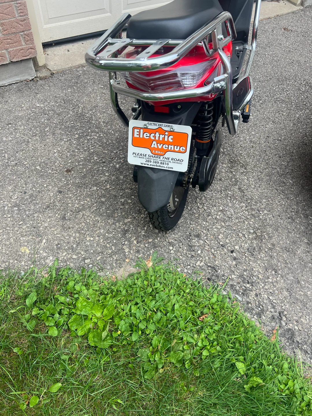 Red Electric Scooter with Helmet