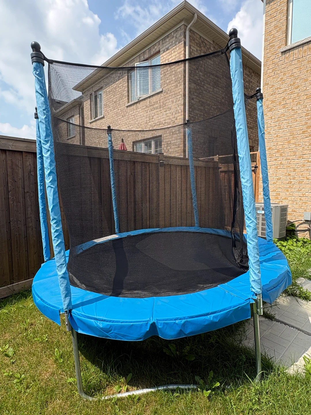 Blue Trampoline with Safety Net