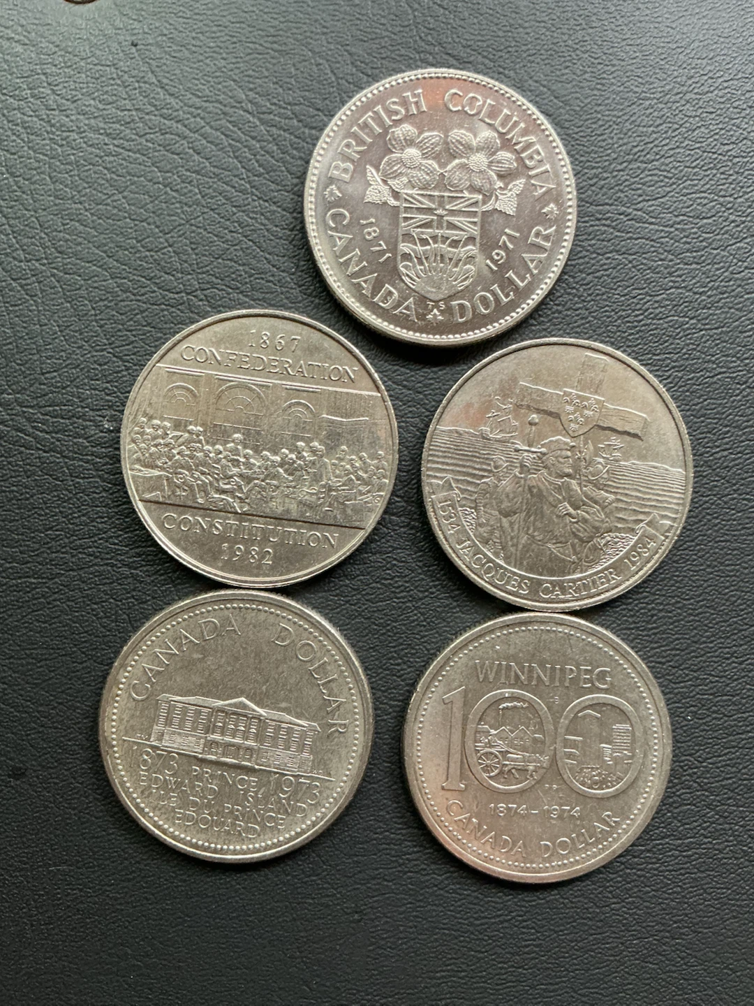 Collection of commemorative Canadian Dollars.