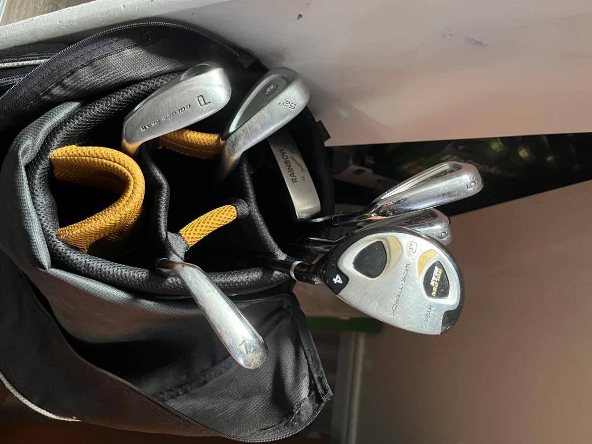 Old golf clubs and bag