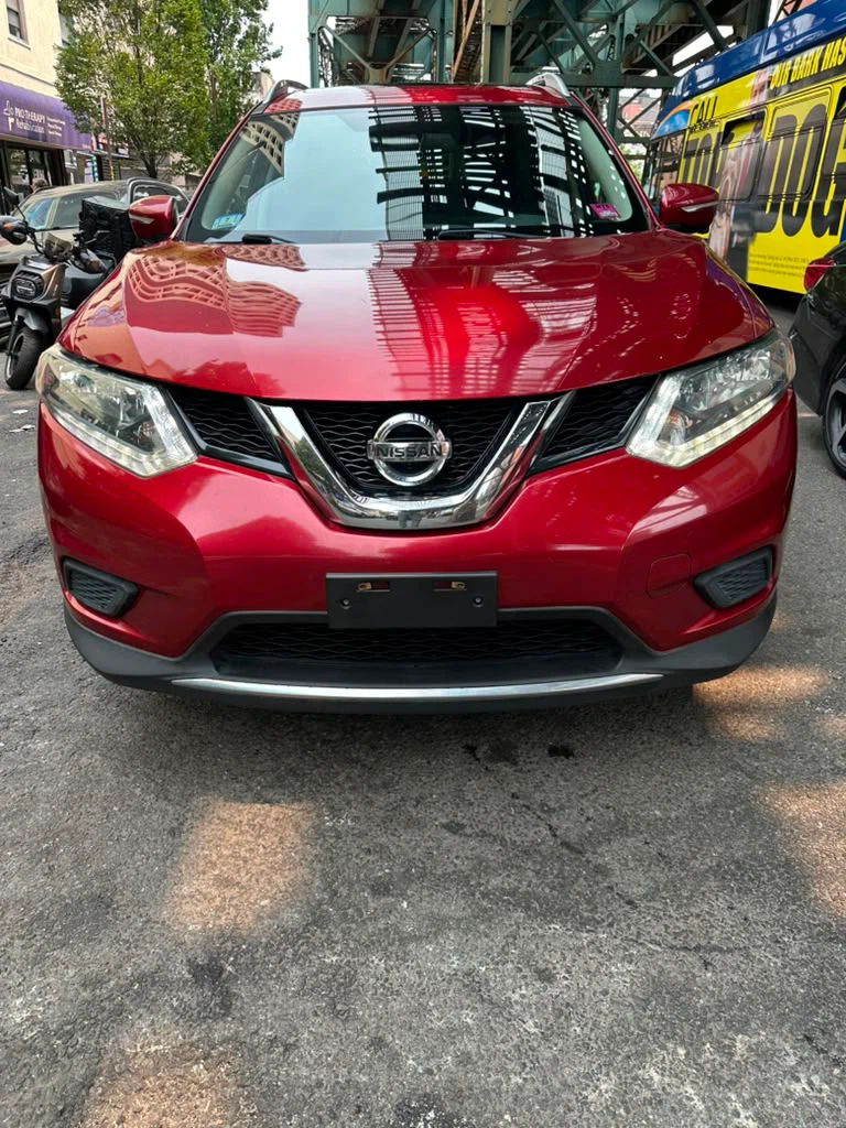 Red Nissan Rogue SUV