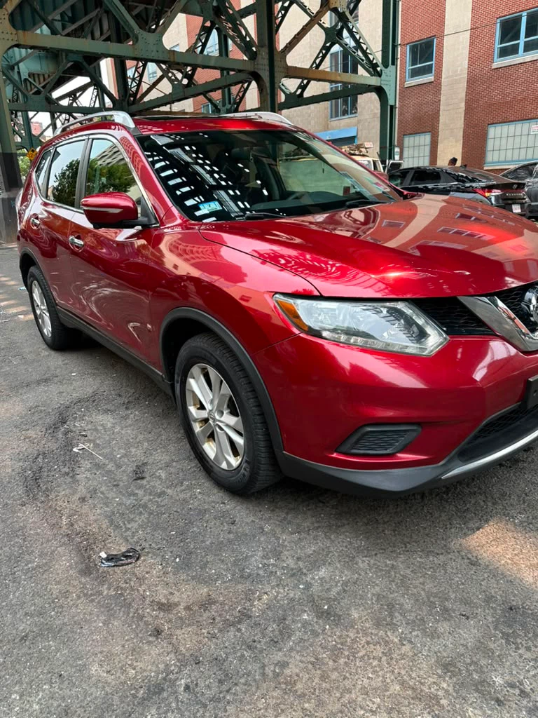 Red Nissan Rogue SUV - photo 2