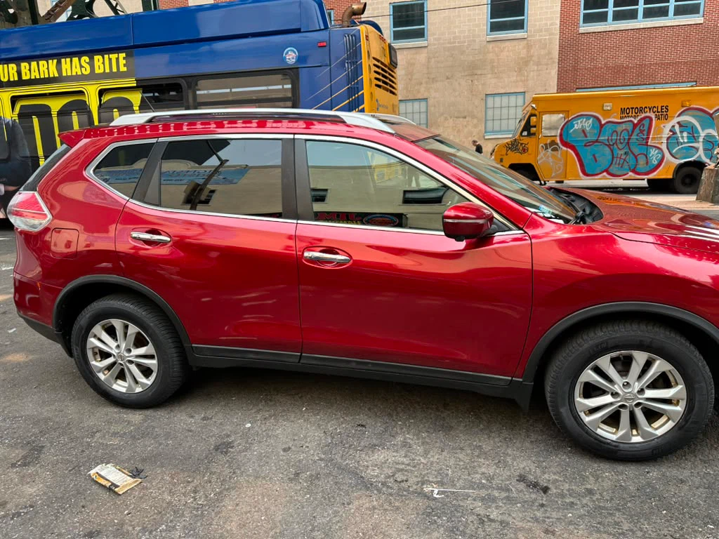 Red Nissan Rogue SUV - photo 3