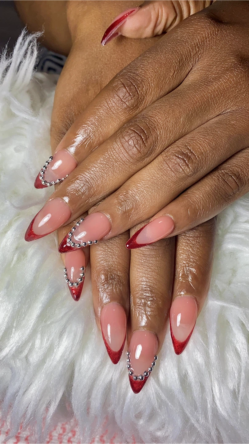 Almond French Tip Nails with Red Glitter and Gems