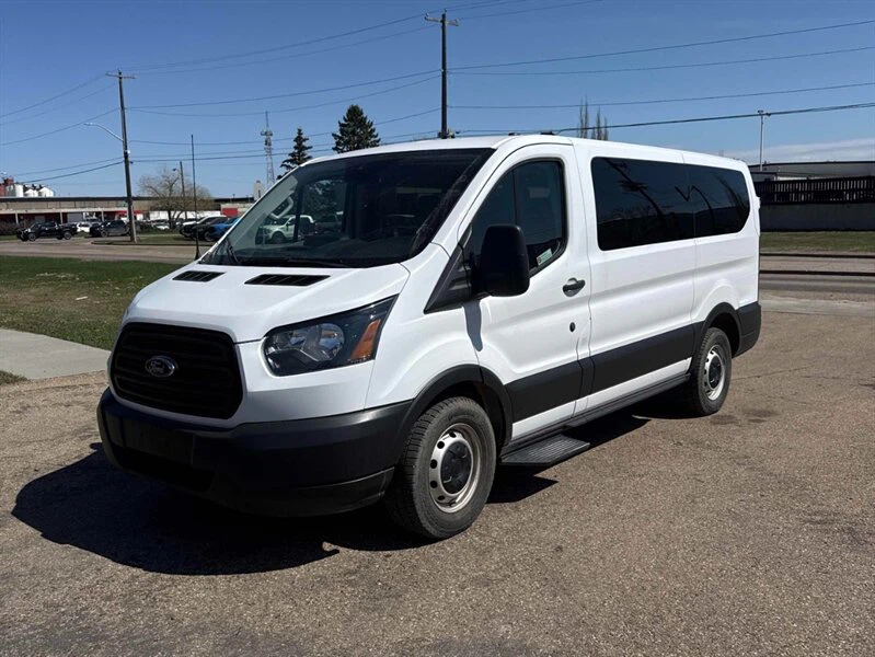 White Ford Transit Passenger Van