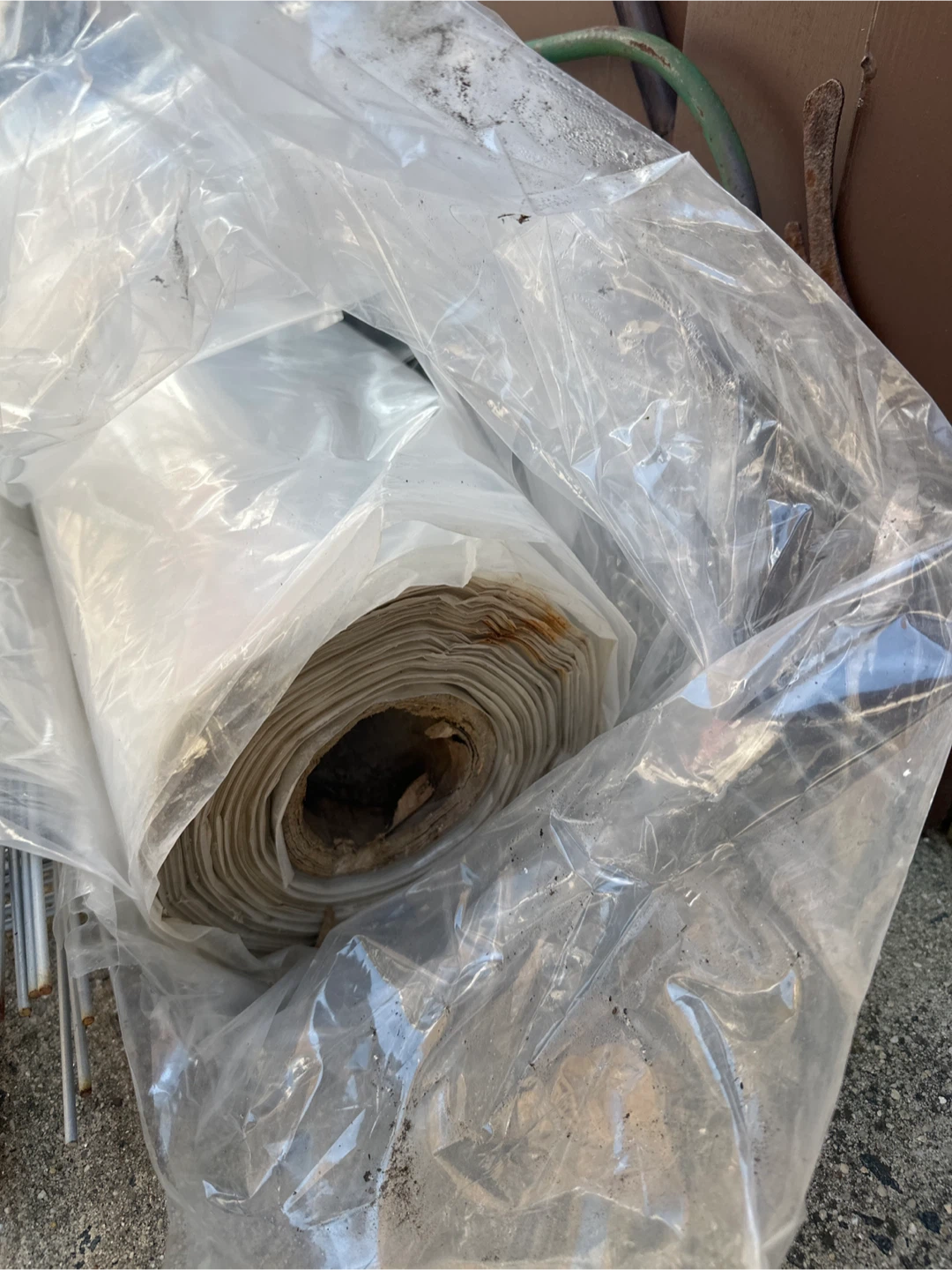 One clear one black roll of plastic sheeting up to 100’ long