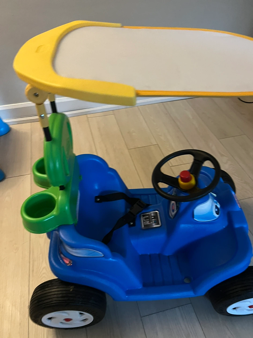 Blue Ride-On Car with Canopy and Activity Board