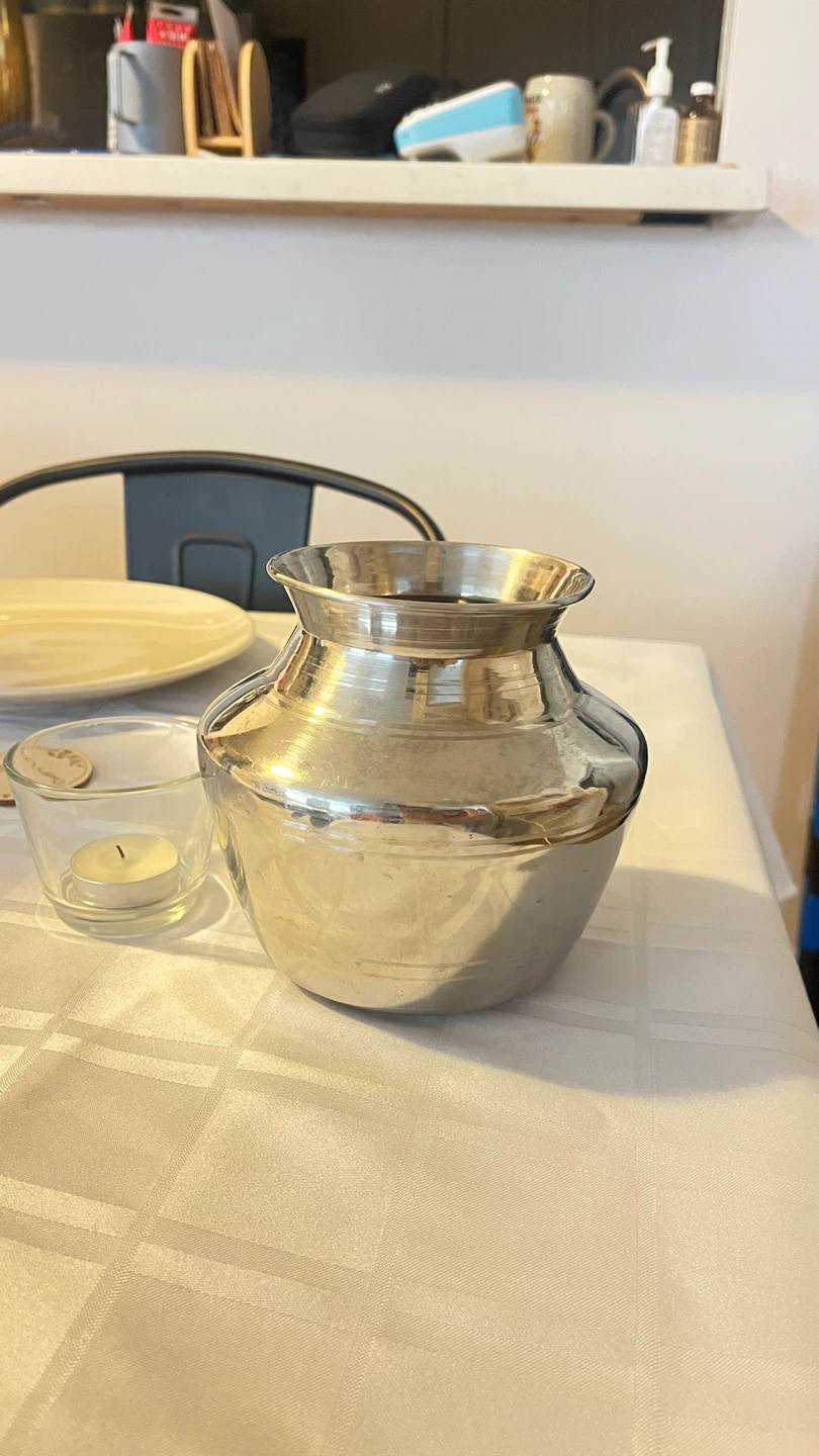 Various silver and gold metal vases / pitchers