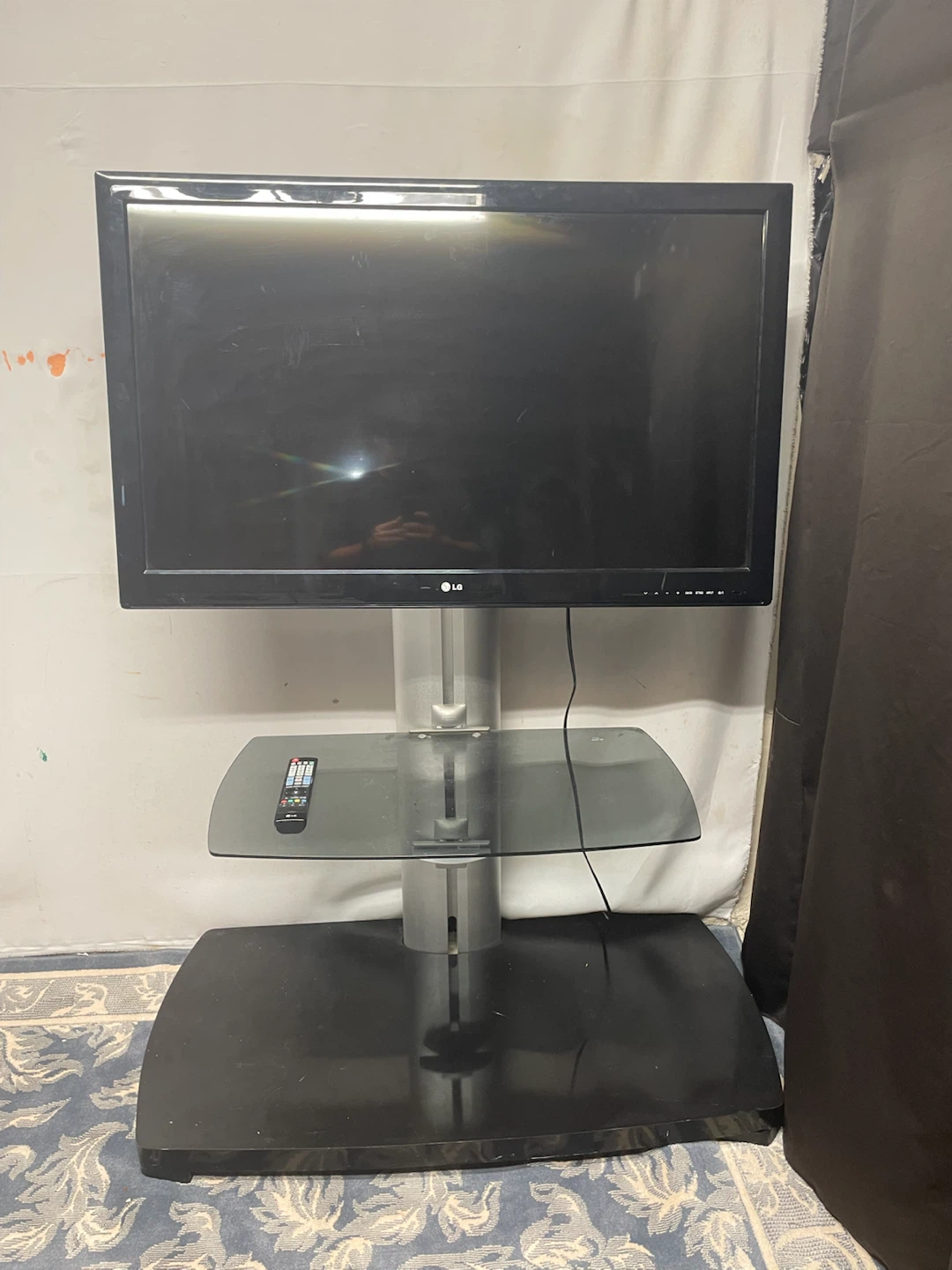 LG TV with Glass and Metal Stand
