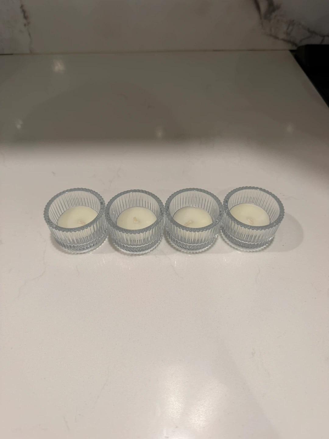 Set of 4 glass candle holders with candles