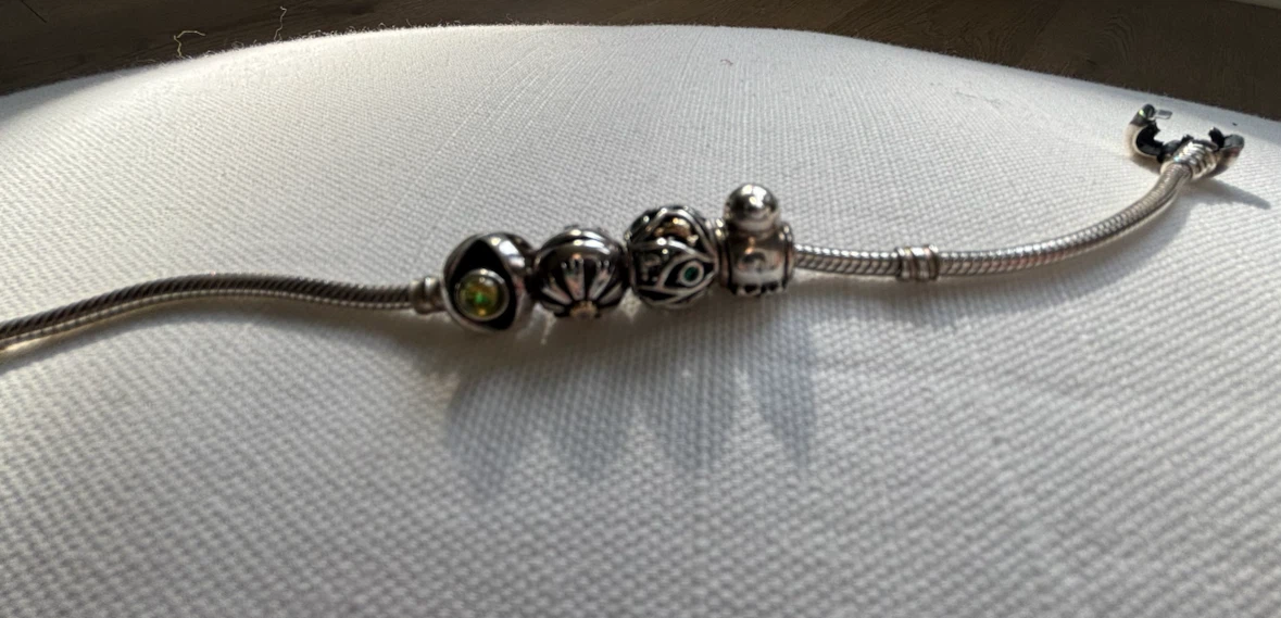 Silver Pandora bracelet with four charms