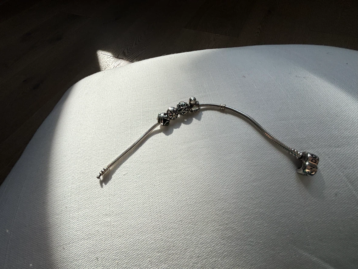 Silver Pandora bracelet with four charms - photo 3