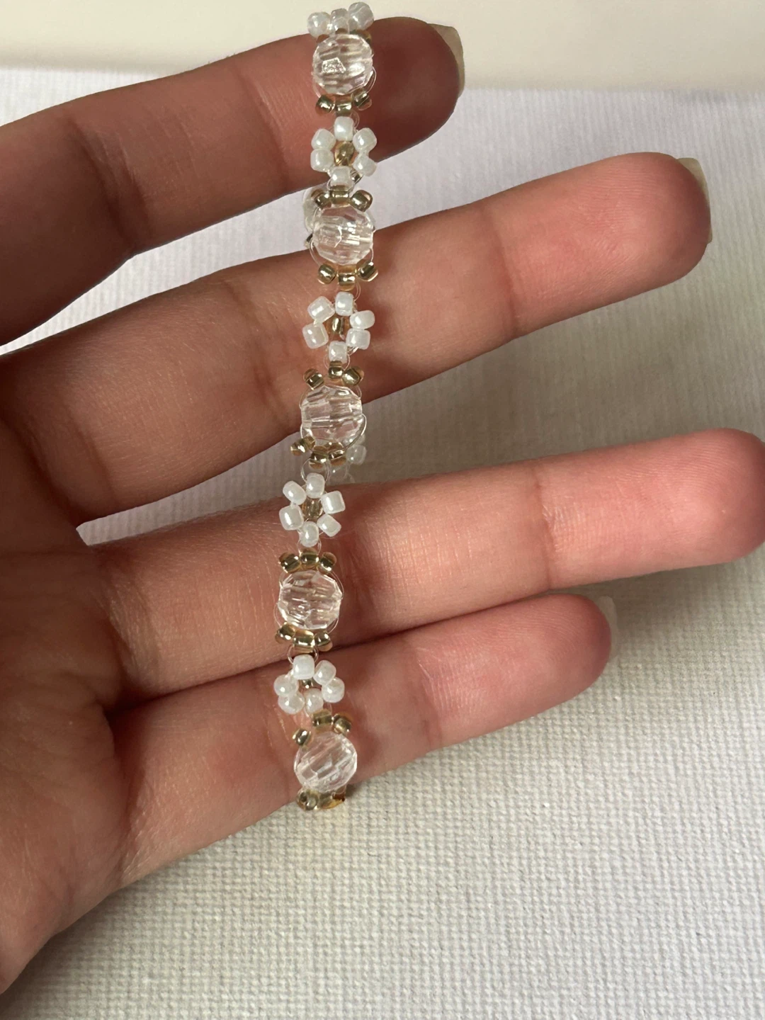 Gold-tone and white beaded bracelet