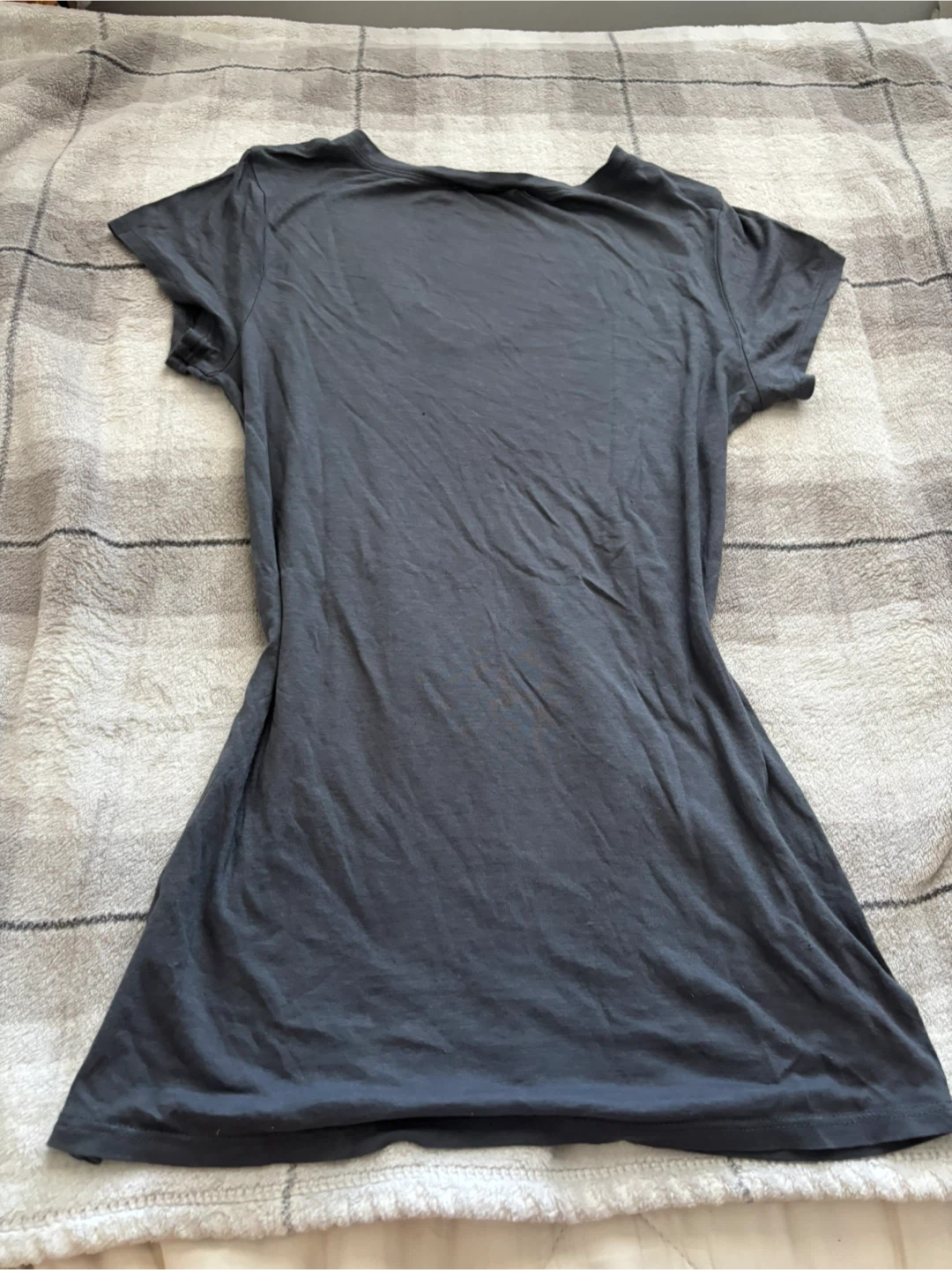 Dark grey shirt with cut off sleeves and v-cut neckline