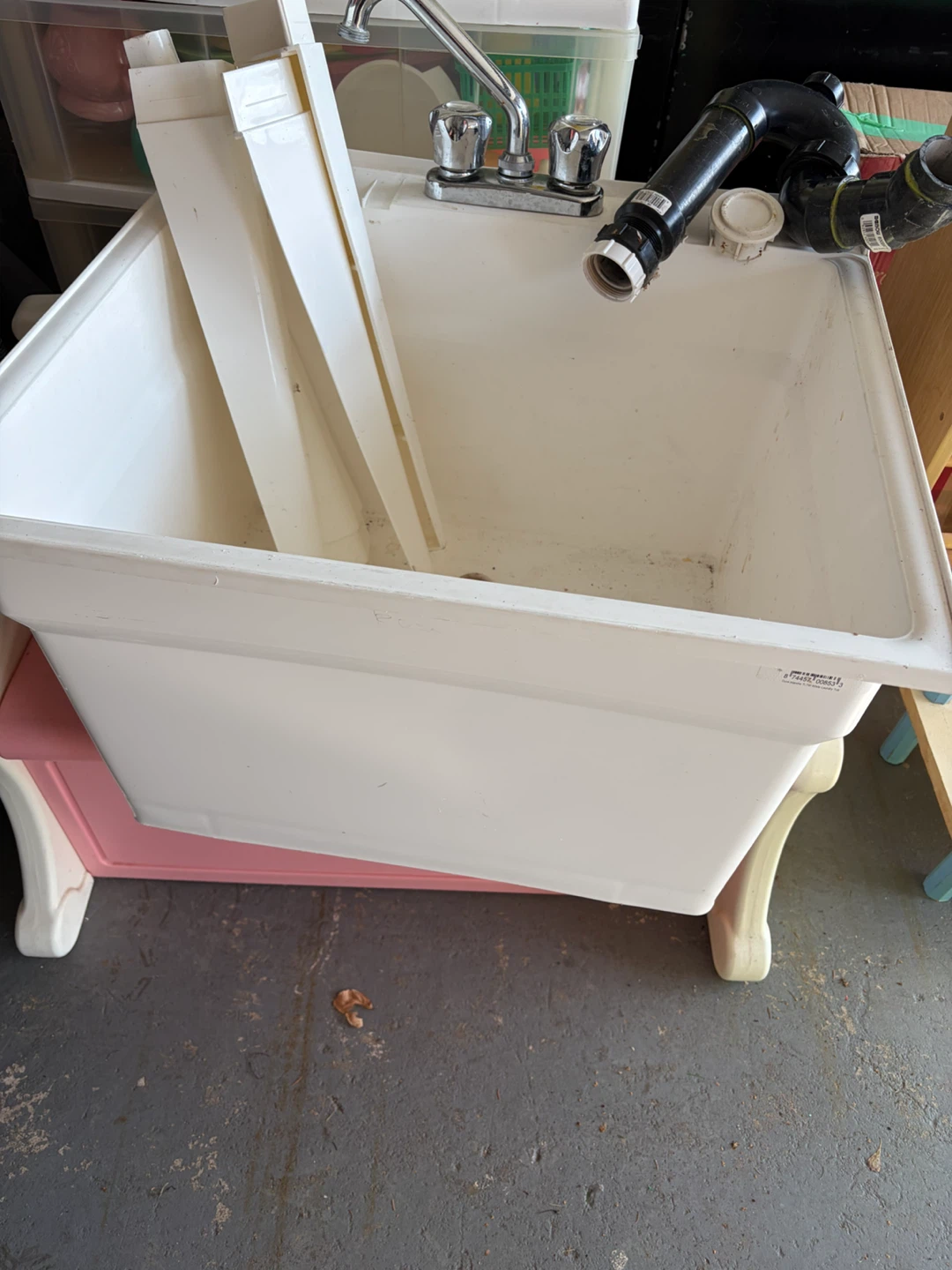 White Laundry Sink Basin with Faucet and Drain Pipes