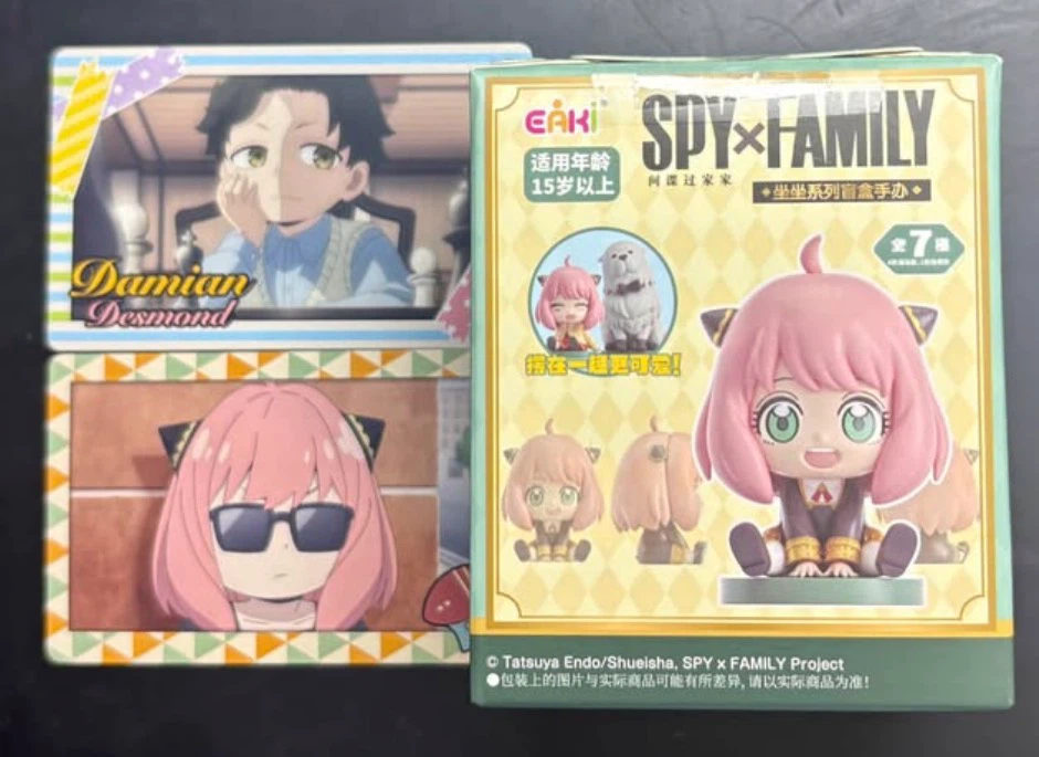Anya Forger figurine from Spy x Family and photocards