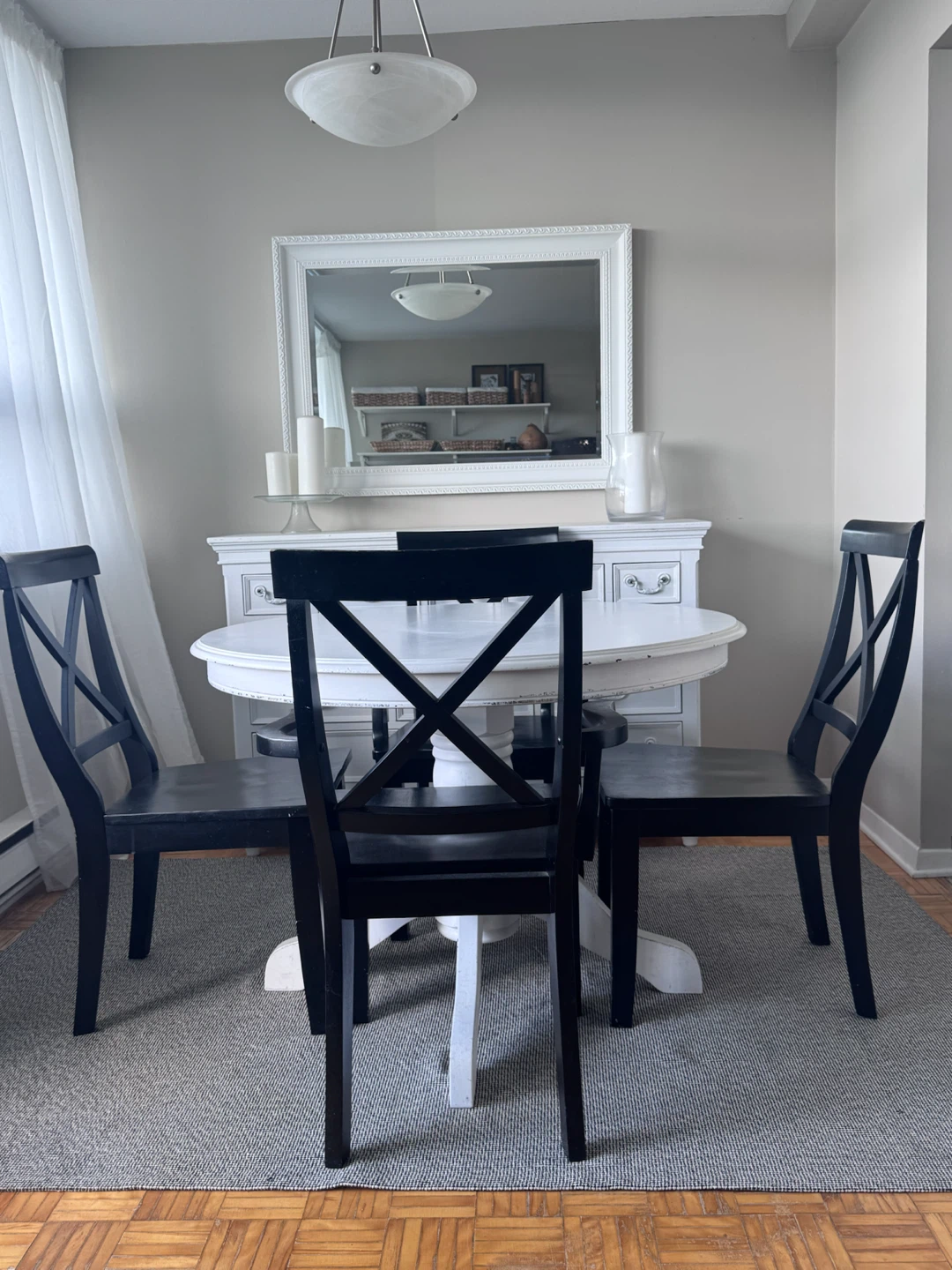 Round White Dining Table with 4 Black Chairs