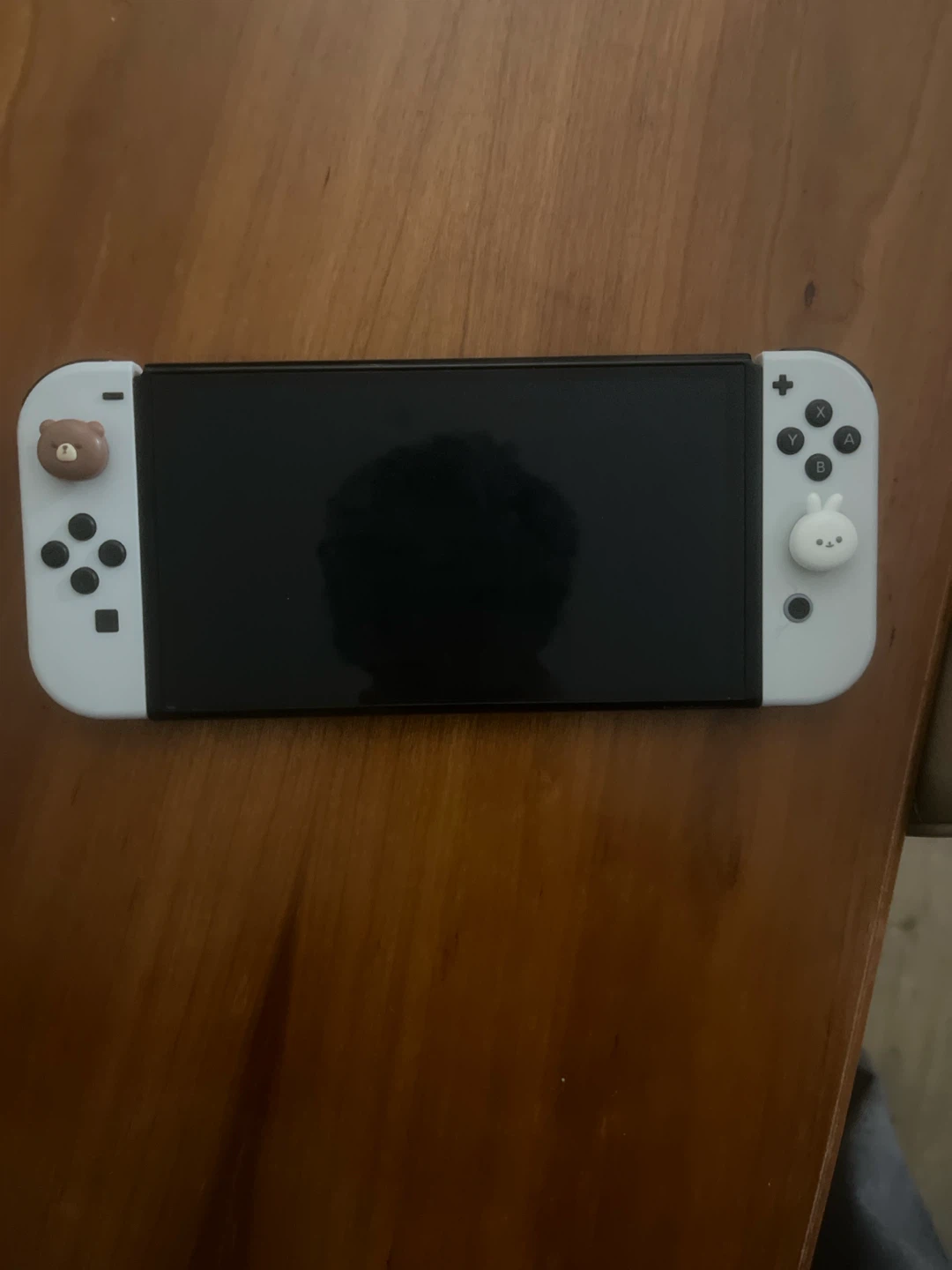 Nintendo Switch OLED with cute bear and bunny thumb grips
