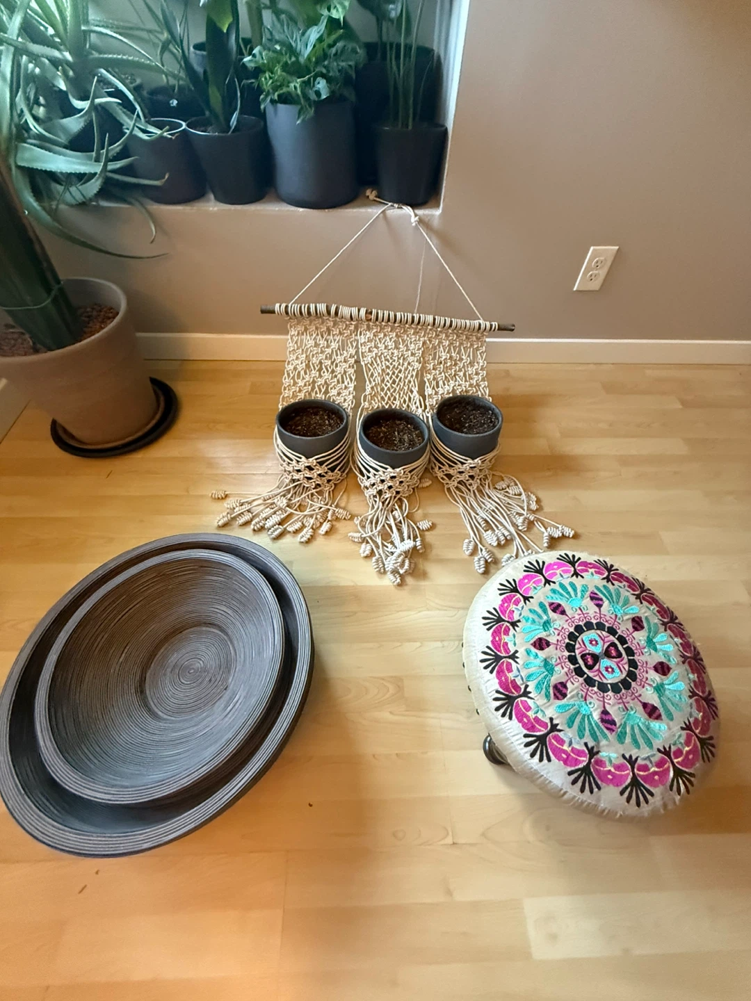 Macrame Plant Hanger, Round Ottoman, and Woven Bowls