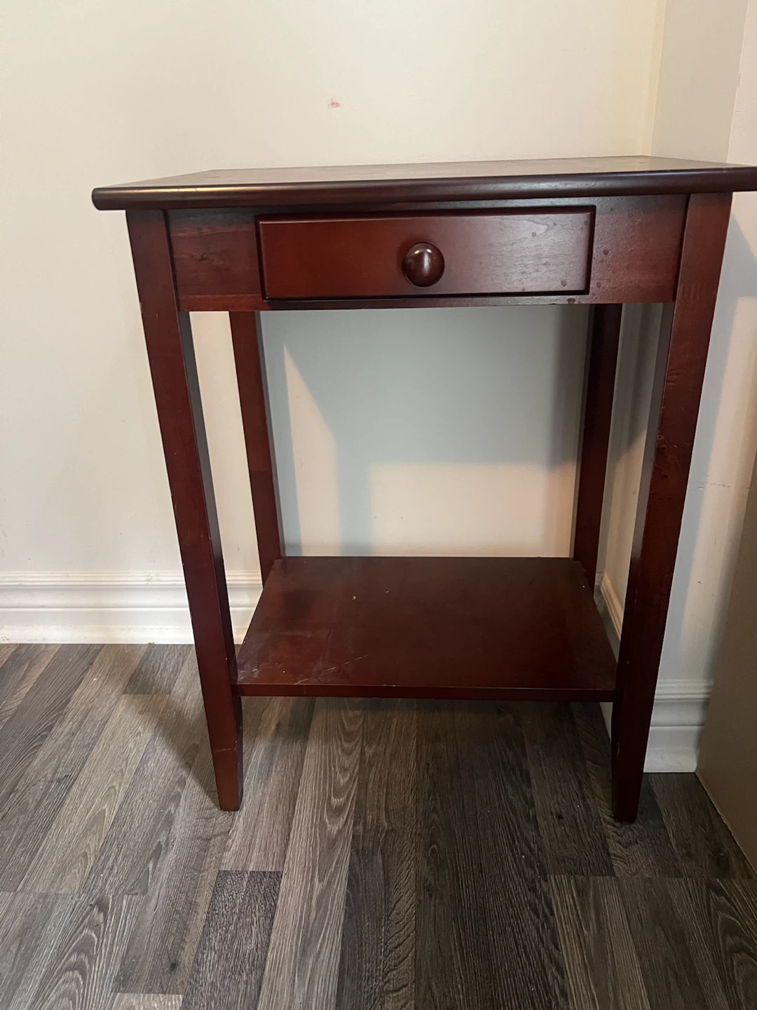 Dark wood side table with drawer