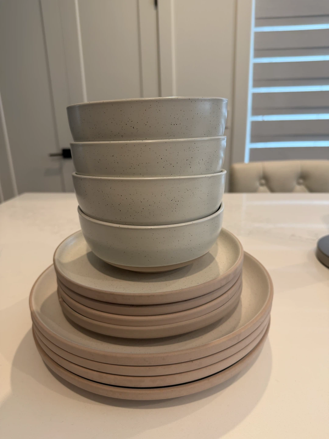 Stack of Speckled Ceramic Bowls and Plates