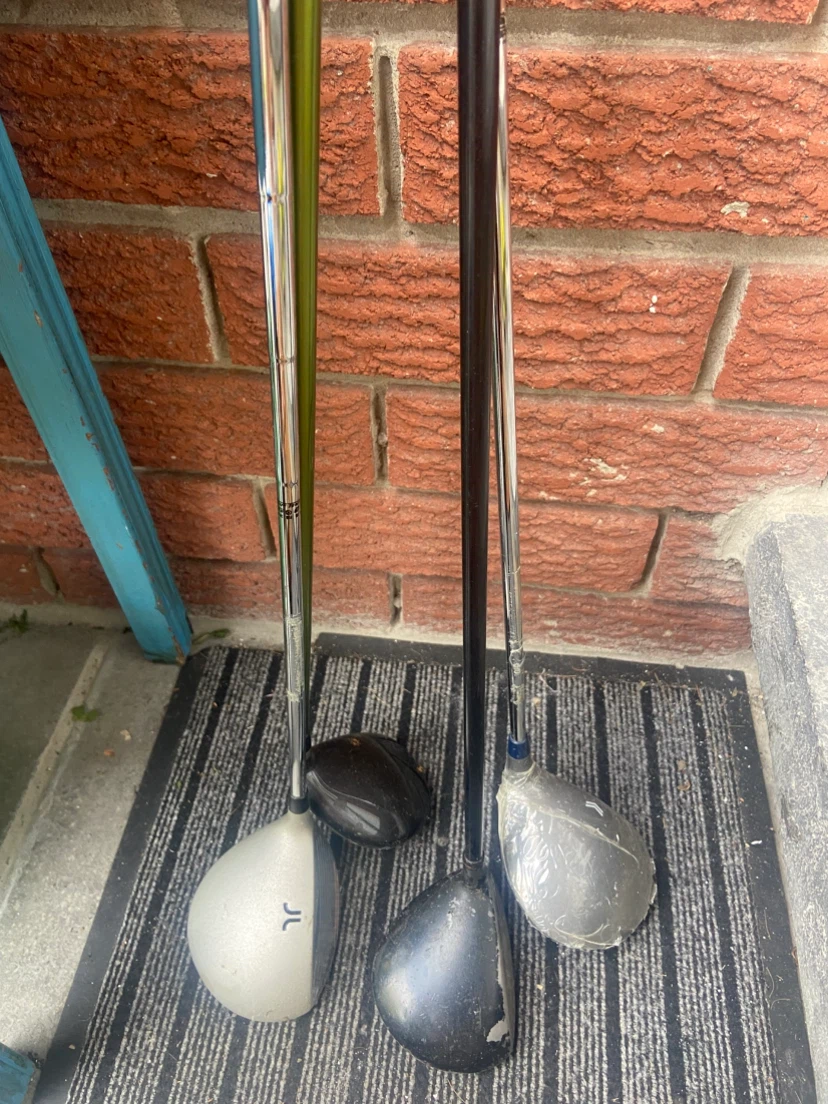 four golf drivers.