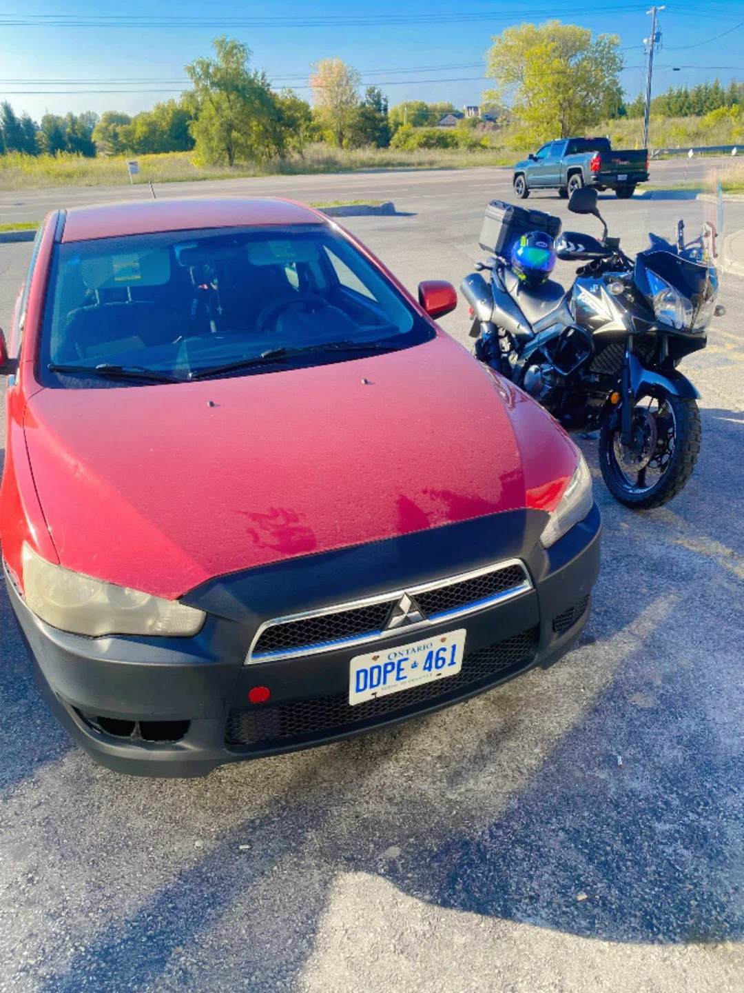 Red Mitsubishi Lancer with Ontario plates