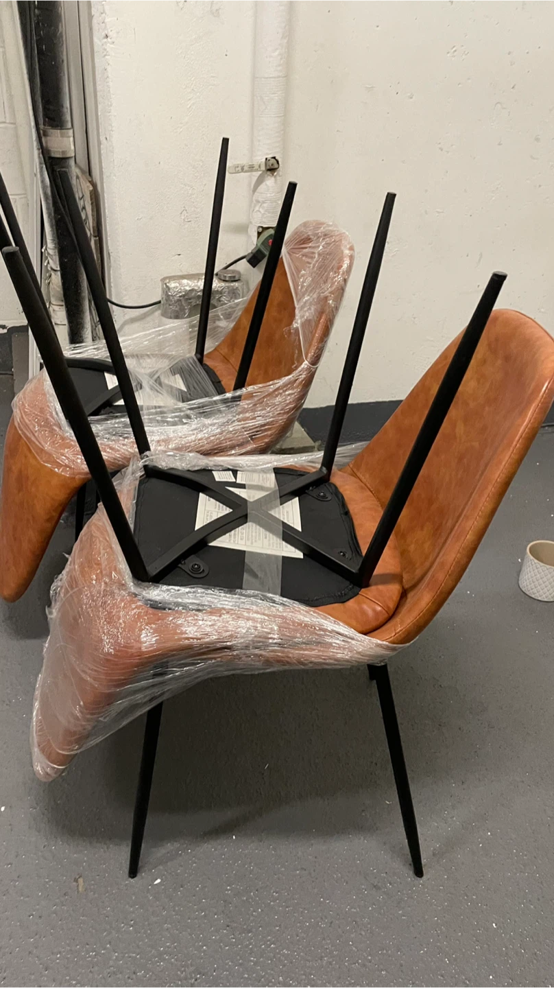 Set of two cognac brown faux leather chairs