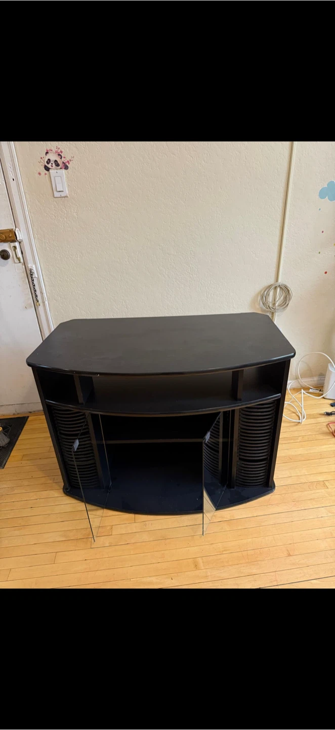 Black TV stand with glass doors and media storage